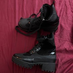 Black vinyl combat boots
